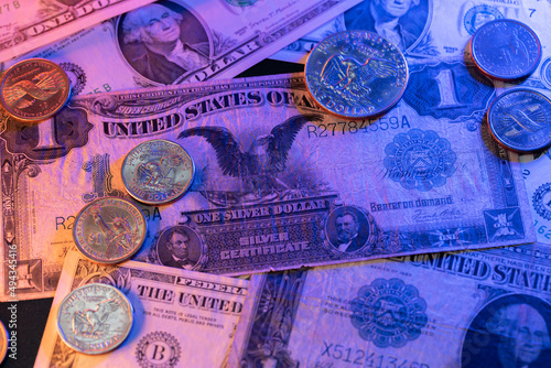 Historic US Dollar banknotes and coins. Black Eagle Dollar bill. One Dollar coin