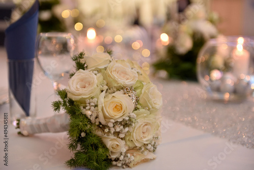 Selective focus shot of a wedding bouquet on the table photo