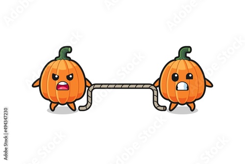cute pumpkin character is playing tug of war game
