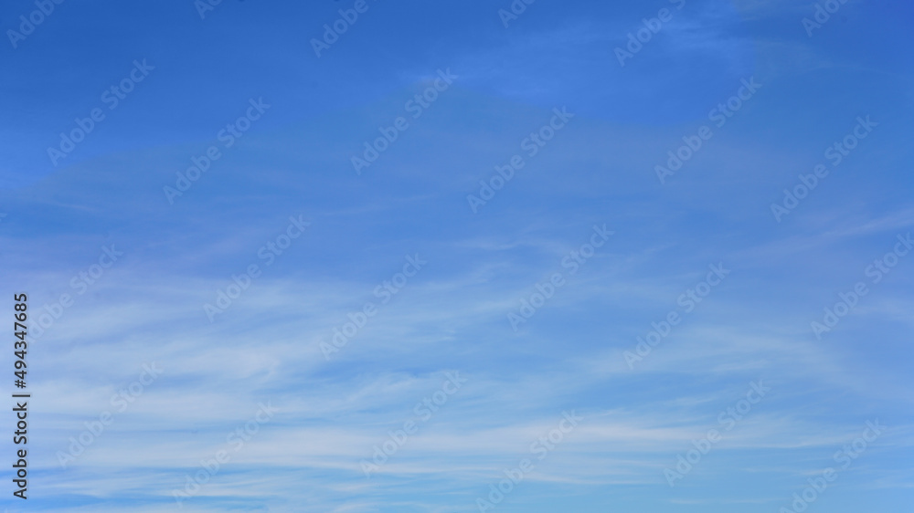White clouds and blue sky suitable for background or sky replacement.