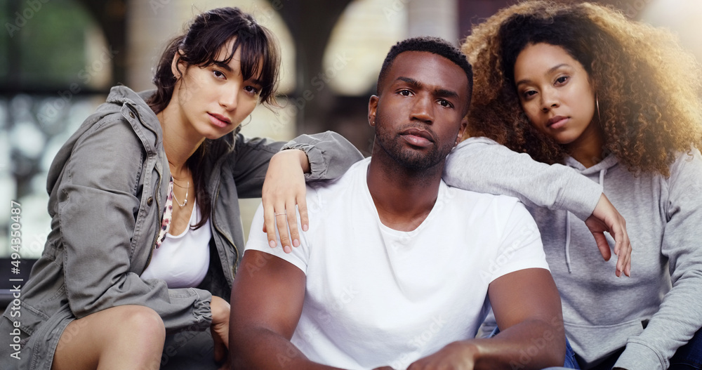 Obraz premium We set the mood in the city. Portrait of a group of friends posing together while relaxing outdoors.