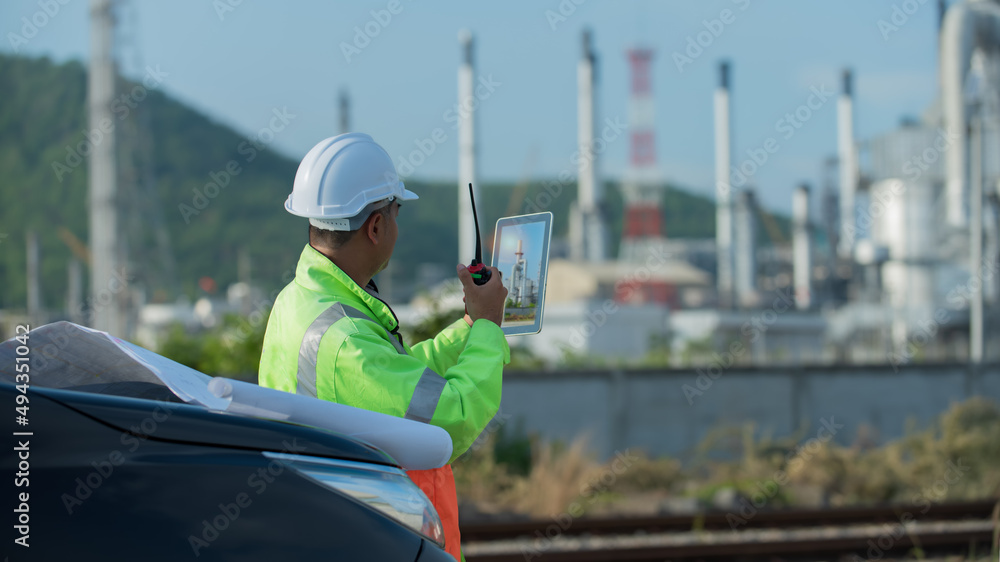 Refinery industry engineer wearing PPE Working at refinery construction site Refinery industry engineer wearing PPE Working at refinery construction site