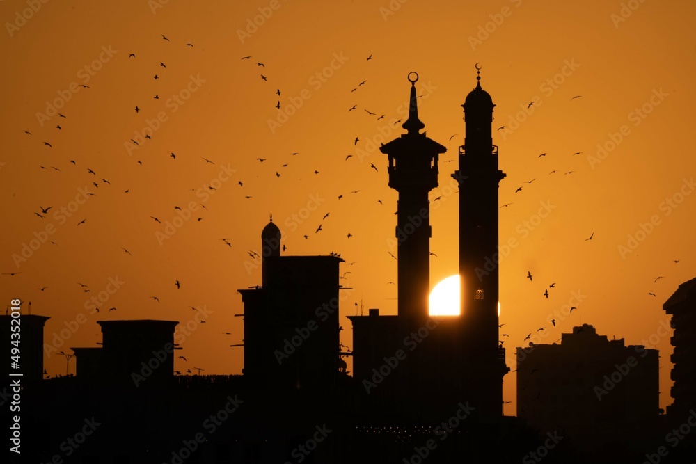 silhouette of a mosque at sunset