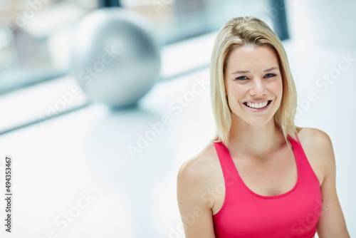 The gym is my second home. Cropped portrait of an attractive young woman in workout attire.