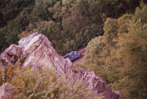 Overhead of commercial freight train in mountain valley