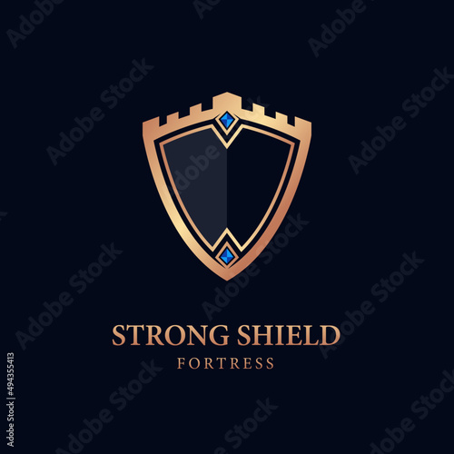 gold shield logo. illustration of the shield with a strong fortress