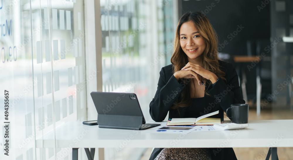 A young woman working with a laptop in a coffee shop business idea financial girl accountant A young woman working with a laptop in a coffee shop business idea financial girl accountant