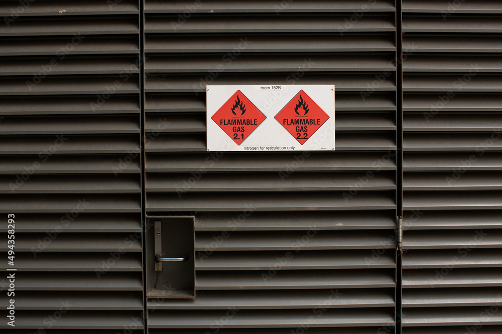 Flammable Gas warning signs attached to access door