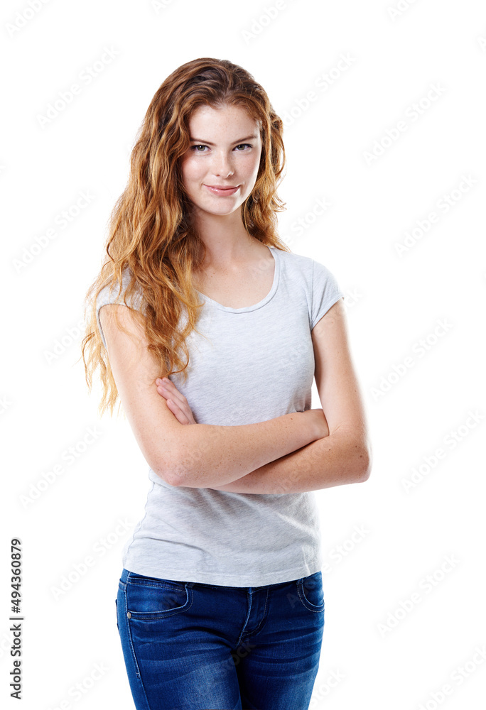 Keeping things casual. Portrait of an attractive young woman standing with her arms crossed against a white background. Keeping things casual. Portrait of an attractive young woman standing with her arms crossed against a white background.