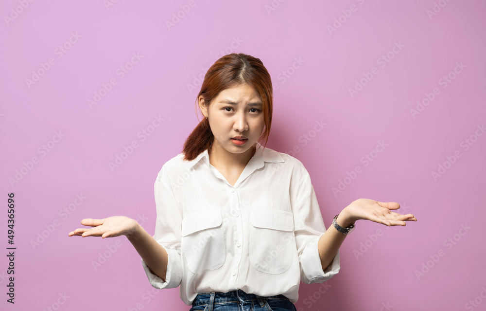 Oops sorry, my mistake. woman shrugging and smiling awkward, feeling guilty, apologizing and looking coy at camera, standing over pink background. Oops sorry, my mistake. woman shrugging and smiling awkward, feeling guilty, apologizing and looking coy at camera, standing over pink background.