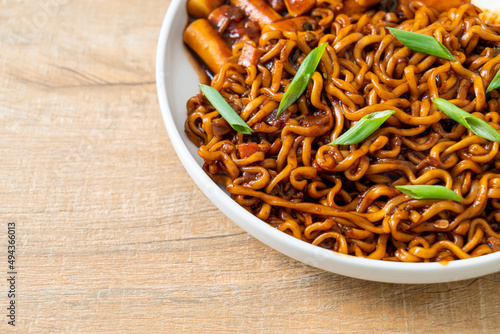 Jjajang Rabokki - Korean instant noodles or Ramyeon with Korean rice cake or Tteokbokki and egg in black bean sauce