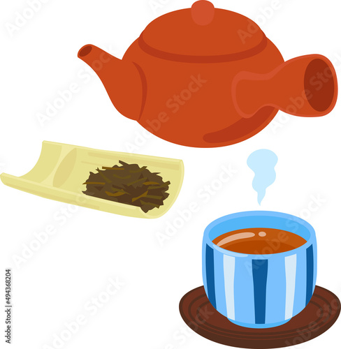 湯呑に入れた焙じ茶と茶葉と急須