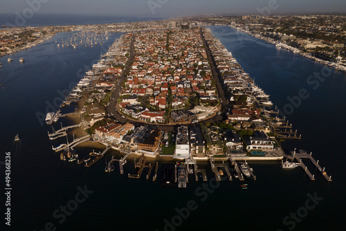 Lido Isle early morning sunrise of island homes and boats in the bay at Newport Beach California photo