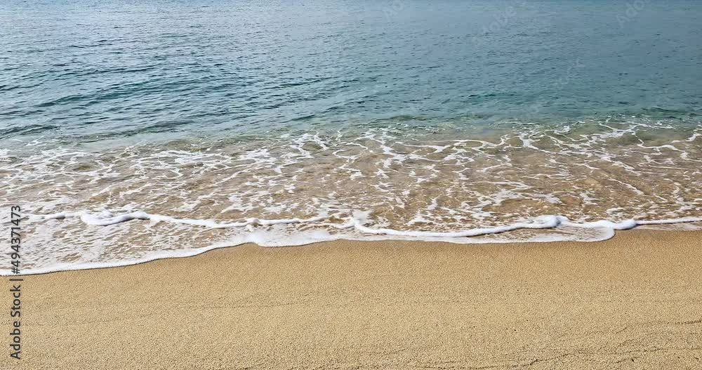 Rolling waves crashed against the sand on the shore. Beautiful seaside scenery in Sanya, Hainan Island, China. Rolling waves crashed against the sand on the shore. Beautiful seaside scenery in Sanya, Hainan Island, China.