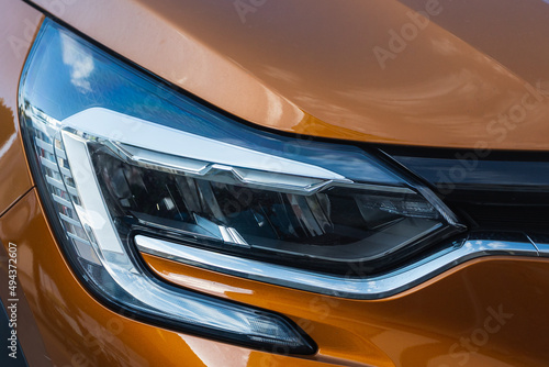 Exterior detail . close up of modern car xenon lamp headlight.