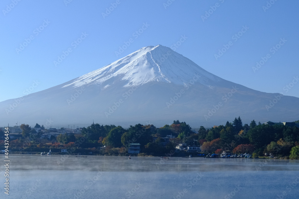 Beautiful mountain Fuji with snow and lake with clear sky background at Kawaguchiko lake in Japan. Mt Fuji is one of famous mountain.
