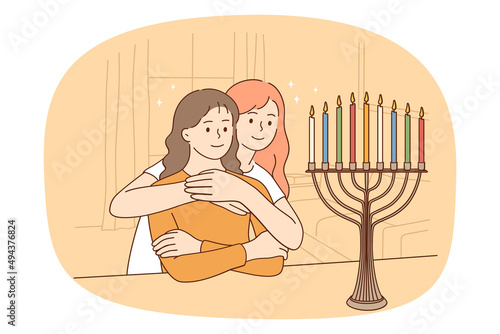 Loving mother hug teen daughter celebrate Hanukkah light menorah together. Caring mom embrace small girl child enlighten candle for Shabbat. Jewish family tradition. Vector illustration. 