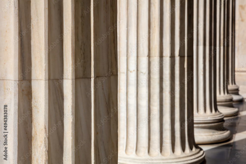 Pillar column white marble. Justice building, court entrance colonnade, close up view Pillar column white marble. Justice building, court entrance colonnade, close up view