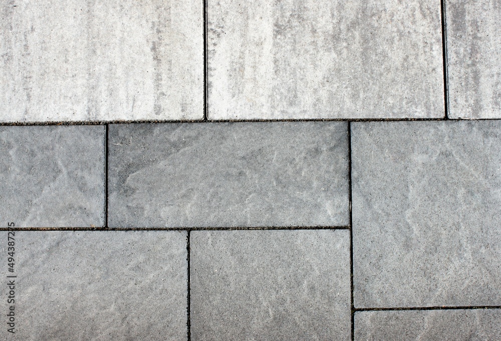 Fototapeta premium Rectangular gray stone slabs with joints