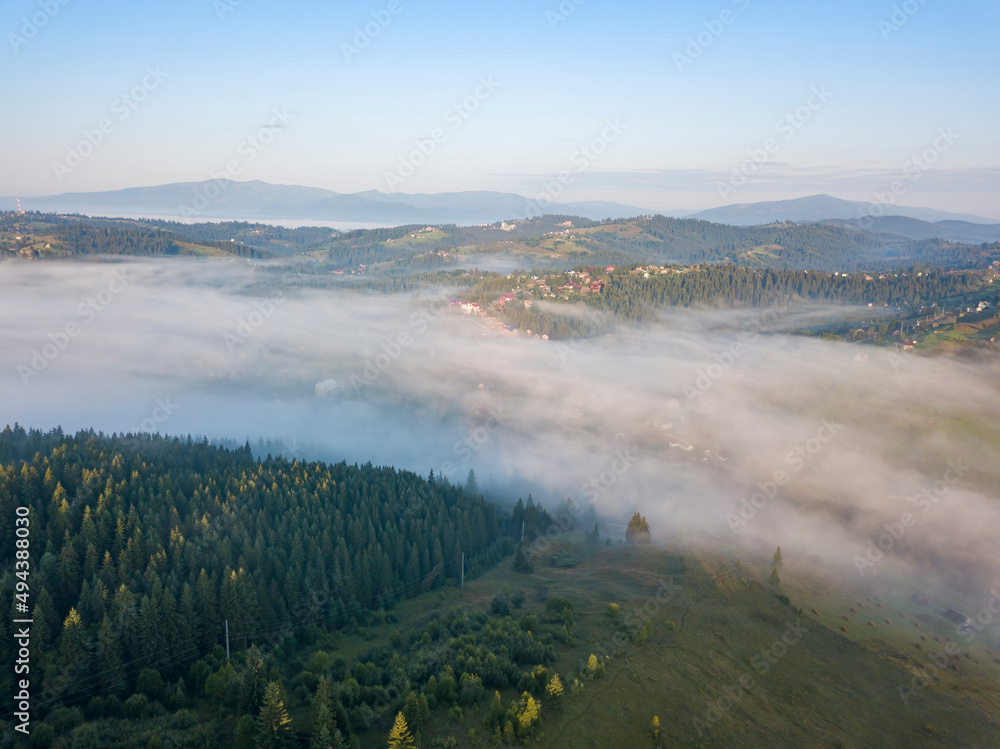 Morning mist in Ukrainian Carpathian mountains. Aerial drone view. Morning mist in Ukrainian Carpathian mountains. Aerial drone view.