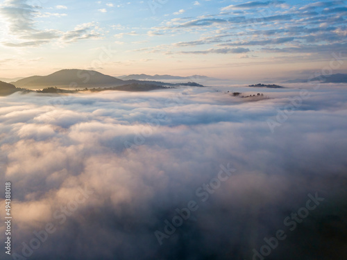 Sunrise over the fog in the Ukrainian Carpathians. Aerial drone view.