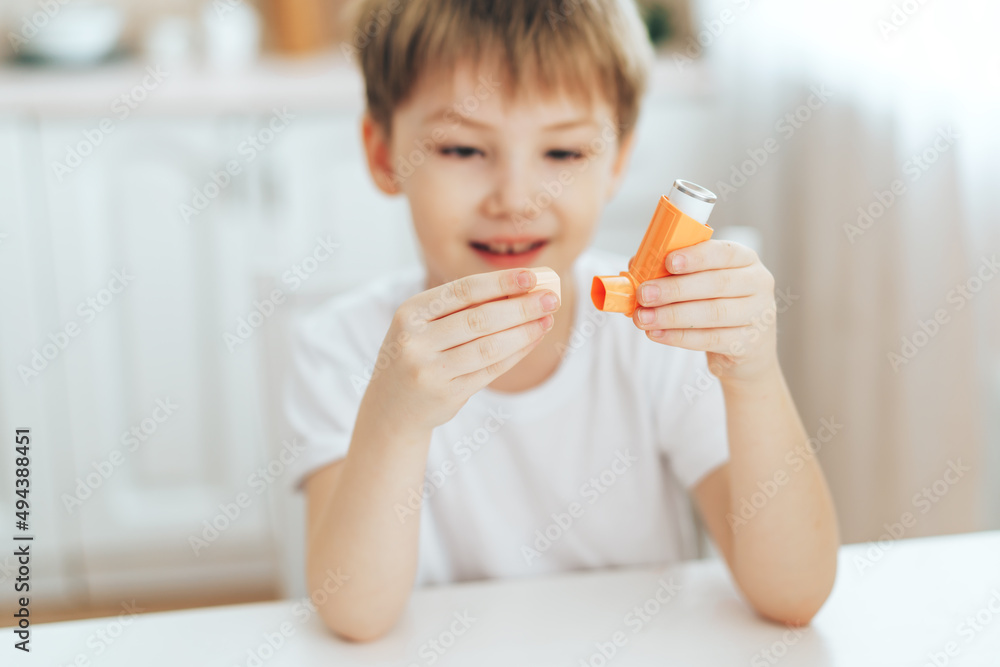 Fototapeta premium Little boy playing with an inhaler.