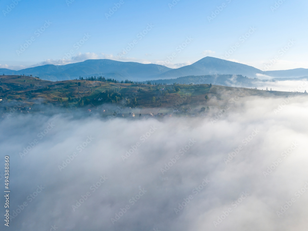 Morning fog in the Ukrainian Carpathians. Aerial drone view. Morning fog in the Ukrainian Carpathians. Aerial drone view.