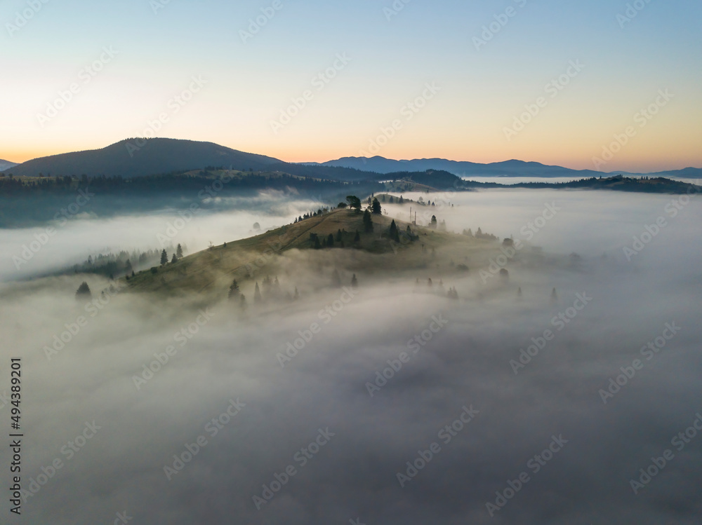 Morning fog in the Ukrainian Carpathians. Aerial drone view. Morning fog in the Ukrainian Carpathians. Aerial drone view.
