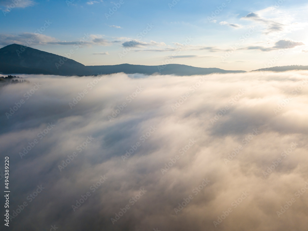 Morning fog in the Ukrainian Carpathians. Aerial drone view. Morning fog in the Ukrainian Carpathians. Aerial drone view.