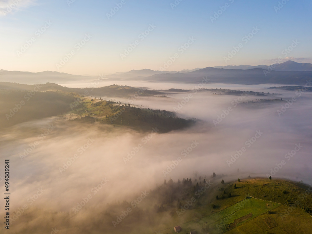 Green mountains of the Ukrainian Carpathians in the morning mist. Aerial drone view. Green mountains of the Ukrainian Carpathians in the morning mist. Aerial drone view.