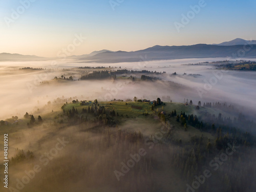 Morning fog in the Ukrainian Carpathians. Aerial drone view.