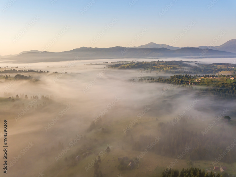 Morning fog in the Ukrainian Carpathians. Aerial drone view.