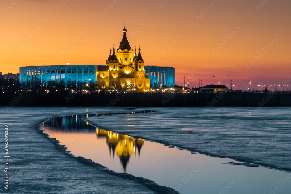 Cathedral in the name of the Holy Prince Alexander Nevsky. Nizhny Novgorod Stadium, Zmereshaya Volga River at sunset