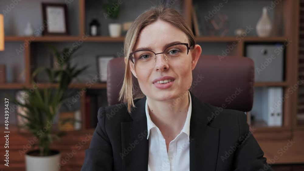 Smiling beautiful young business woman online teacher job applicant manager talks with client make conference video call chat speak during distance job interview look at camera in office, webcam view. Smiling beautiful young business woman online teacher job applicant manager talks with client make conference video call chat speak during distance job interview look at camera in office, webcam view.