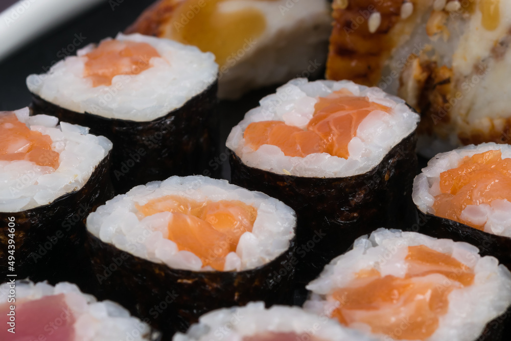 classic rolls with red fish, close-up background
