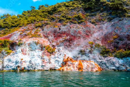 Small active volcano nearly submerge  in the water