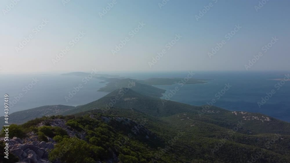 aerial shot of Croatian island Losinj from the peak of Televrina mountain aerial shot of Croatian island Losinj from the peak of Televrina mountain