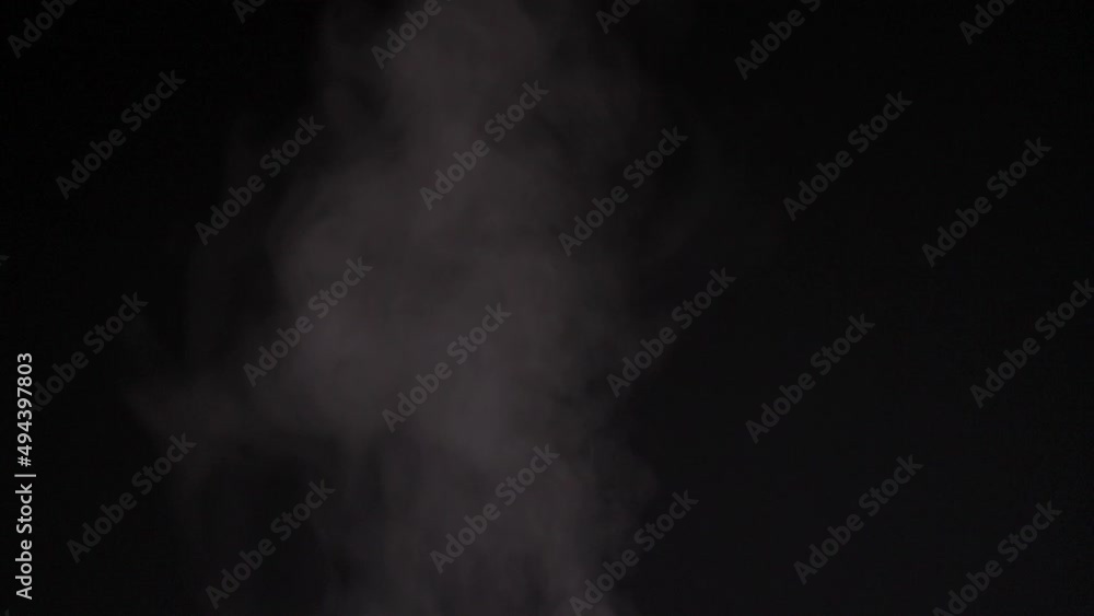 Steam of water coming out from the middle of screen makes dreamy and suspicious atmosphere on its video. This video combination of black and white movement can be used as background Steam of water coming out from the middle of screen makes dreamy and suspicious atmosphere on its video. This video combination of black and white movement can be used as background