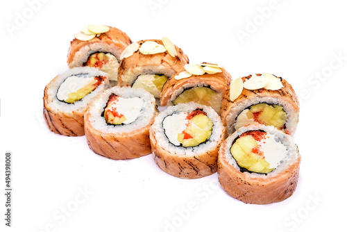 Sushi set with mango, red fish, red caviar and philadelphia cheese on a white background