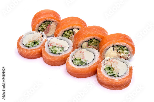 Traditional sushi set with red fish, cucumber and philadelphia cheese on a white background