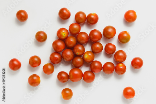 Cherry tomatoes on white background.