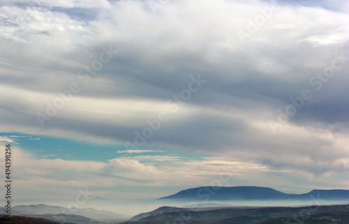 foggy mountain and clouds in the sky © Kybele