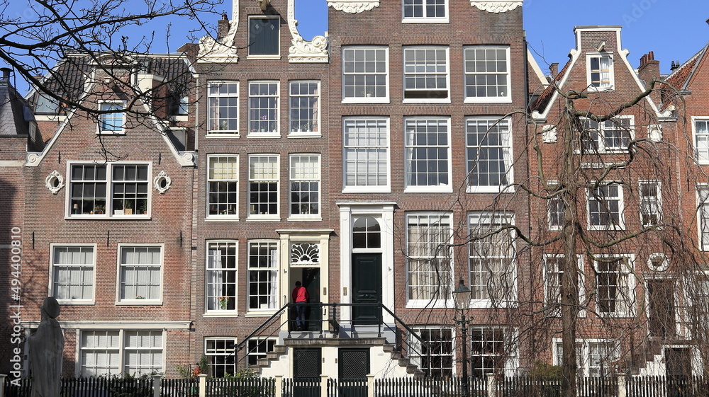 Amsterdam Begijnhof Courtyard View with Historic Brick House Facades, Netherlands