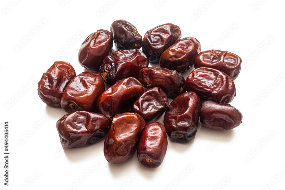 Dried dates with wrinkled skin on a white background Dried dates with wrinkled skin on a white background