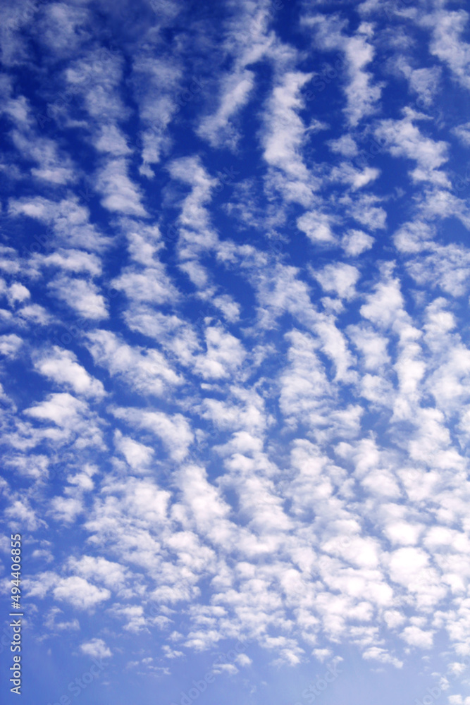 Horizontal or vertical nature background with white clouds in the blue sky