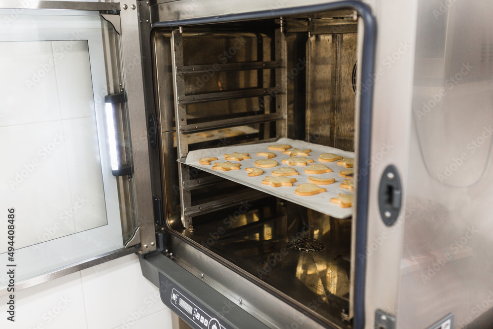 Freshly baked cookies inside the bakery oven Freshly baked cookies inside the bakery oven