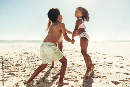 Kids playing a game together at the beach