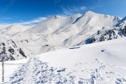Snowcapped mountain peaks in Italian Alps. Mountain range of Monte Carega (Small Dolomites) in winter, and Lessinia Plateau (Altopiano della Lessinia). Veneto and Trentino Alto Adige, Italy, Europe. © Alberto Masnovo