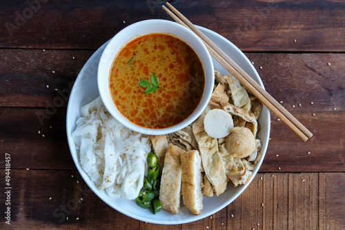 Popular Chinese street food. Yong Tau Foo with Chee Cheong Fun aka Steamed Rice Noodle with Fish Paste Tofu in Sweet and Spicy Soy Chili Sauce