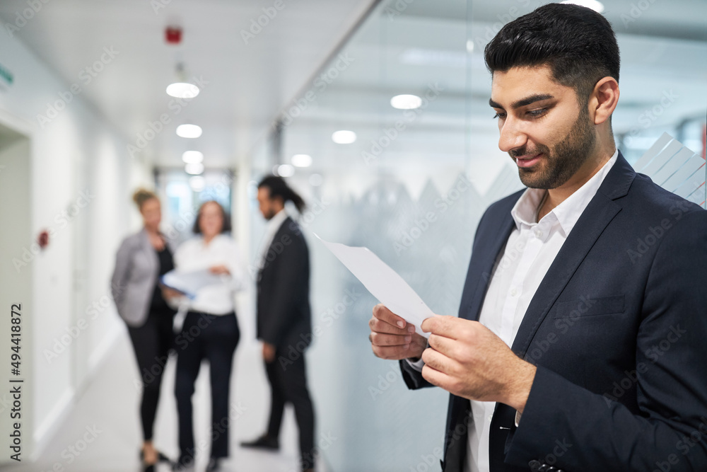 Business man as applicant or trainee reads certificate Business man as applicant or trainee reads certificate